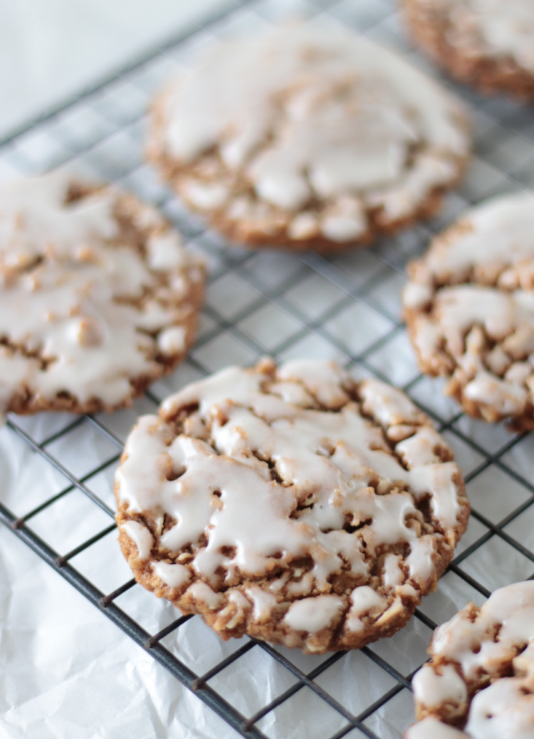 iced oatmeal gingerbread cookies on cookie rack