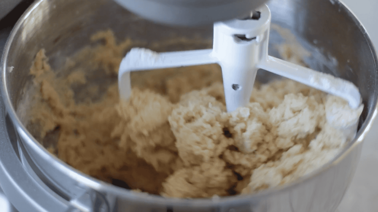 Mixing bowl of snickerdoodle sugar cookie dough.
