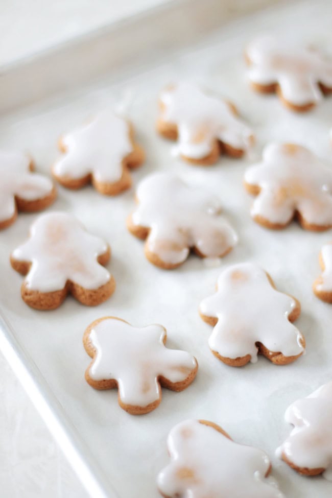 iced gingerbread man cookies on baking sheet