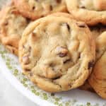 Toll House chocolate chip cookies on white plate.