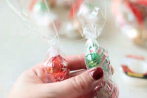 hands holding both ends of candy wreath
