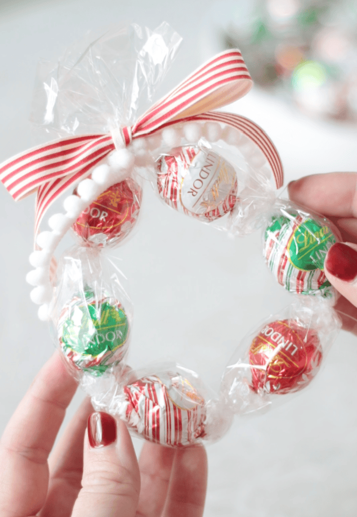 hands holding chocolate truffle wreath