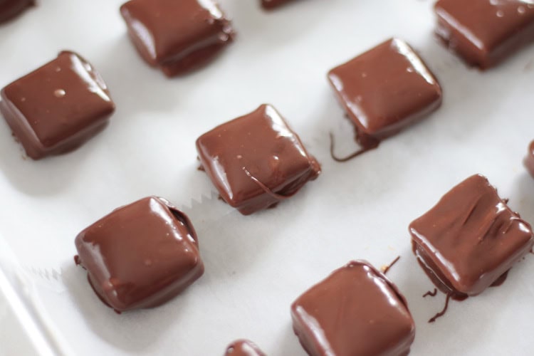 cheez its dipped in chocolate on baking sheet