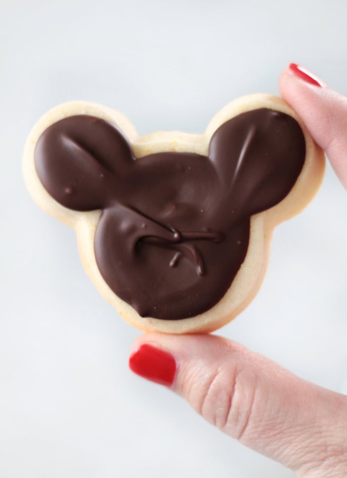 hand holding mickey cookie