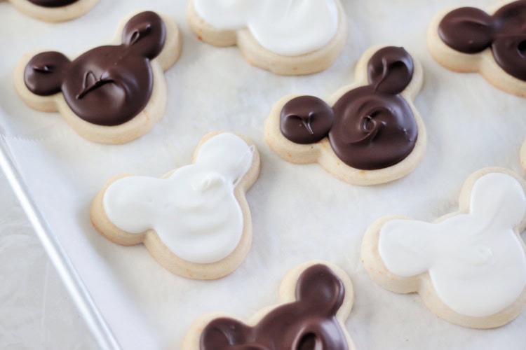 mickey mouse shaped cookies on baking sheet