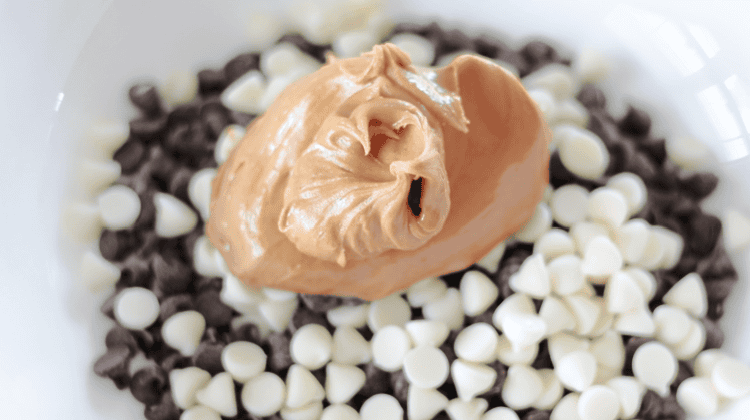 bowl of chocoalte chips, white chocolate chips and peanut butter