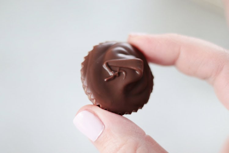 hand holding peanut butter meltaway candy