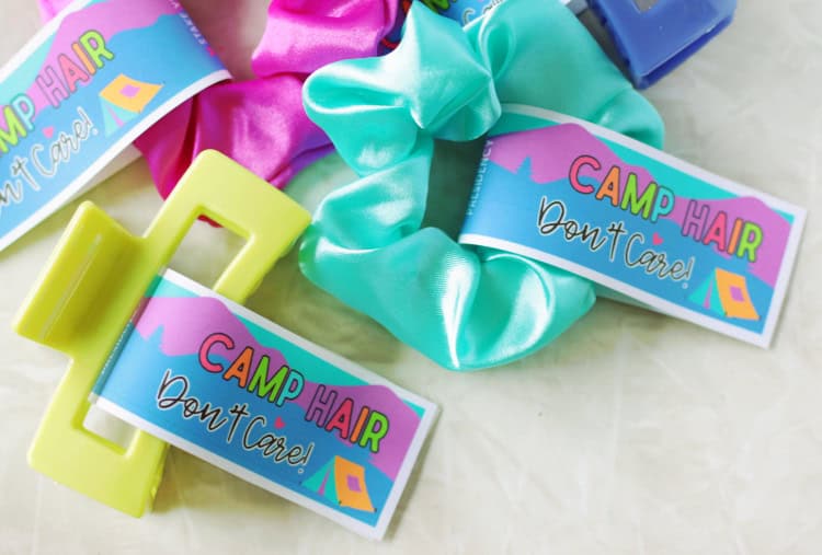a scrunchie and a hair clip with cardstock tags attached