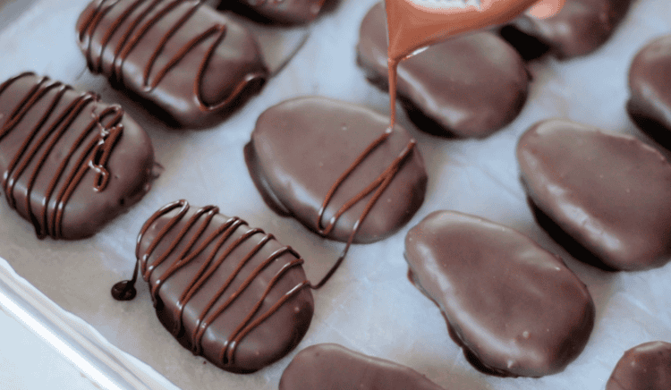 chocolate drizzled onto chocolate cream eggs