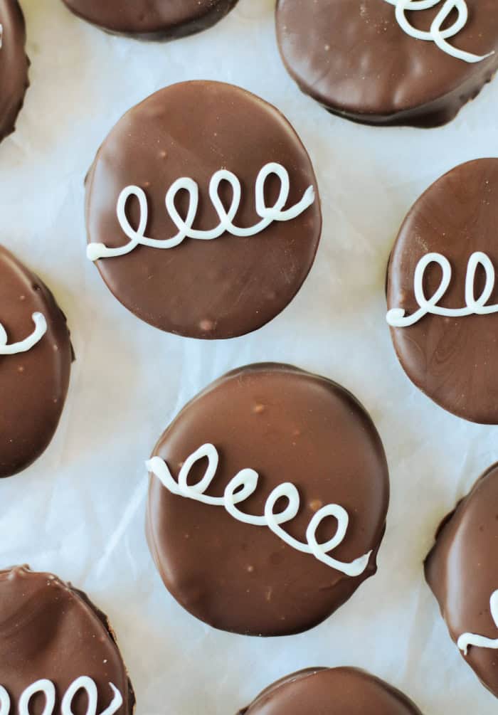 chocolate marshmallow eggs with white chocolate squiggles on top