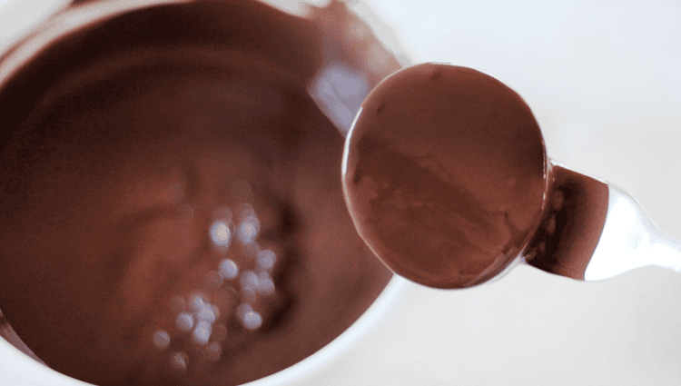 marshmallow dipped into melted chocolate