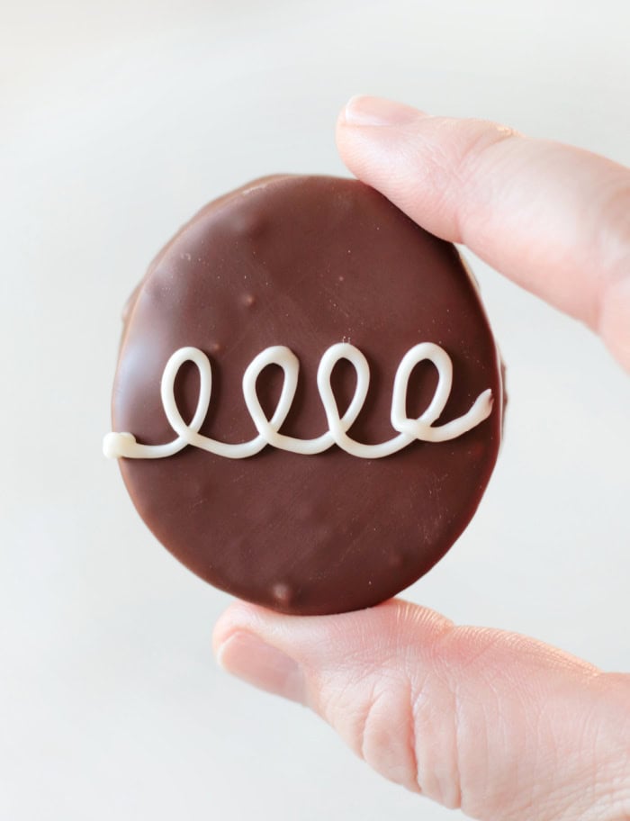 hand holding chocolate marshmallow egg