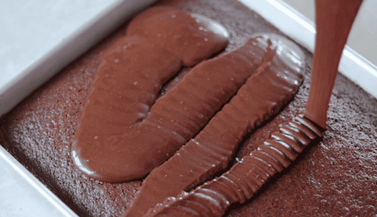 warm frosting poured over hot cake