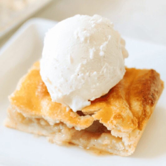 Slice of apple slab pie ala mode.