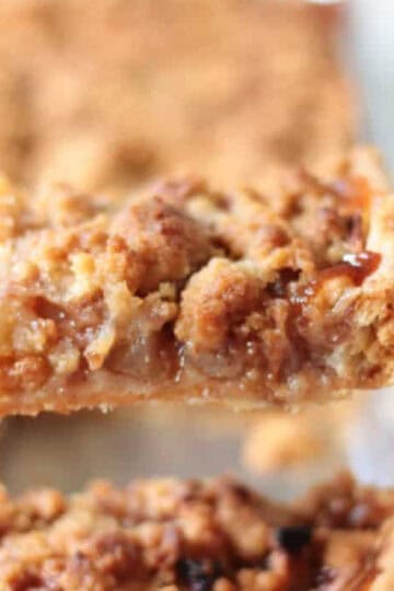 Slice of apple slab pie on spatula.
