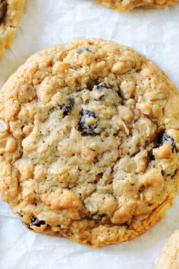 Oatmeal raisin cookies on parchment paper.