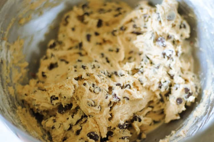 metal mixing bowl of chocolate chip cookie dough