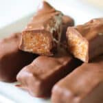 100 grand bars cut in half on plate