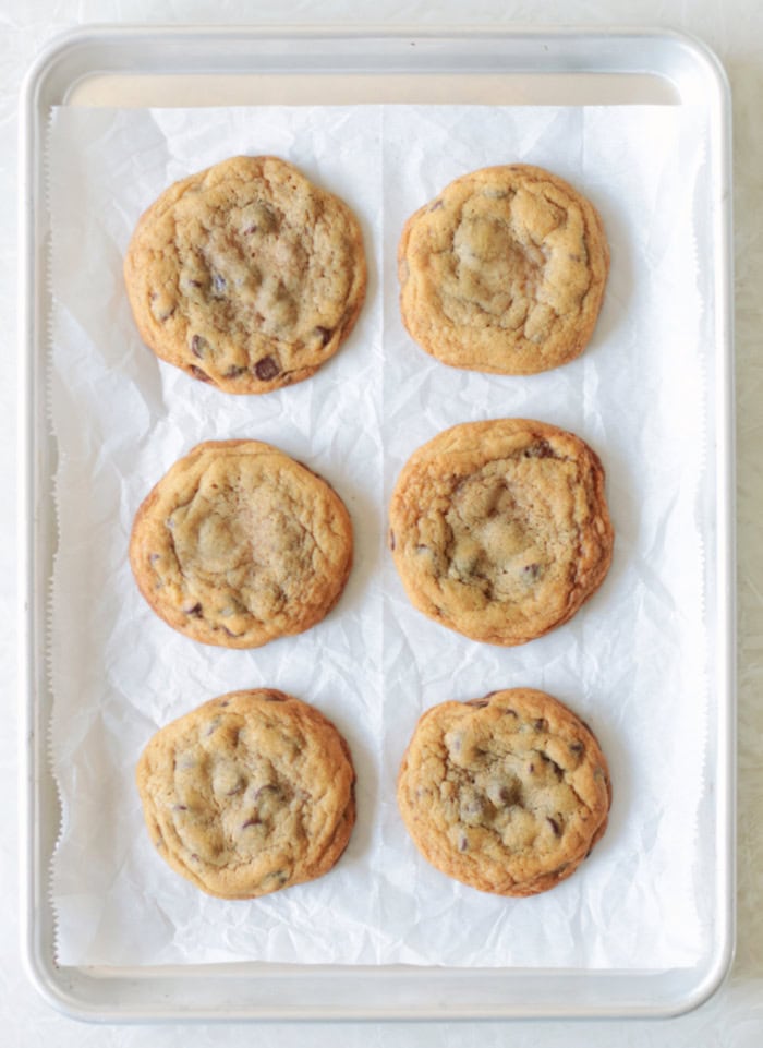 baking sheet with 6 bakes mrs fields cookies on it