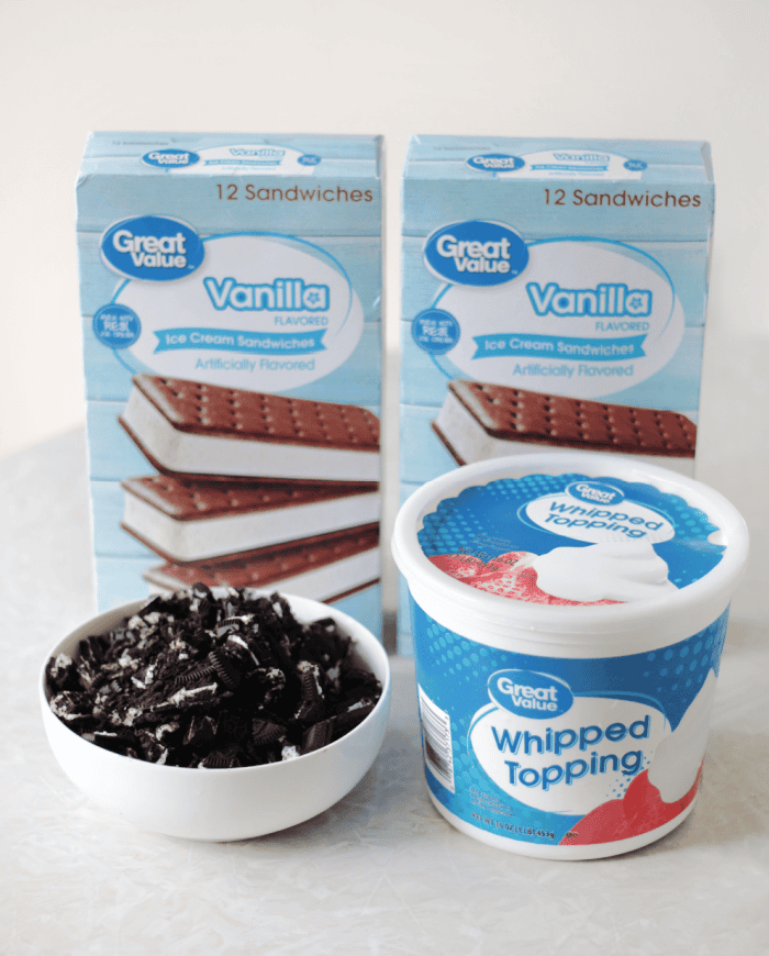 two boxes of ice cream sandwiches, bowl of crushed oreo cookies and container of cool whip topping