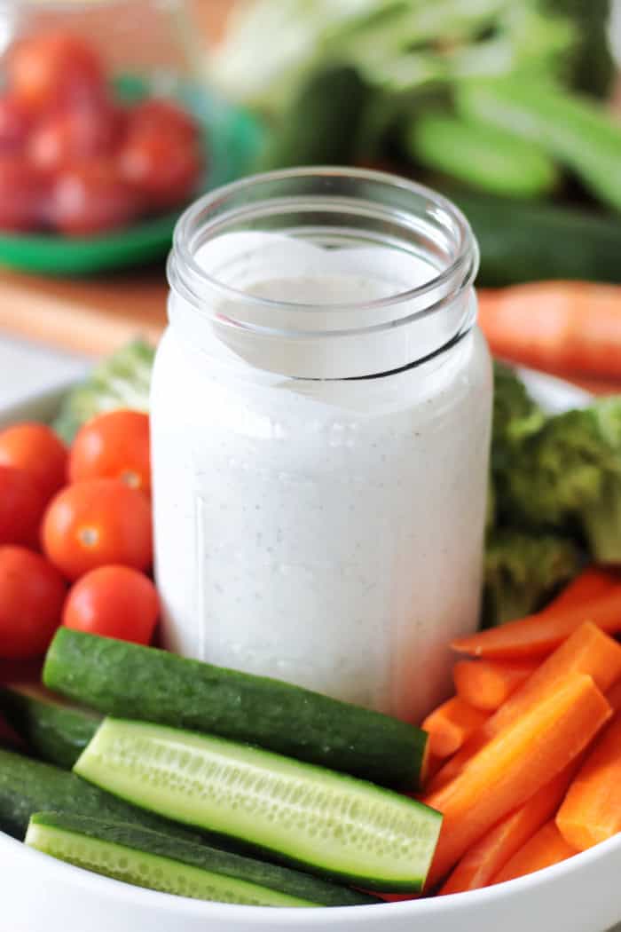 jar of homemade ranch dressing with veggie platter