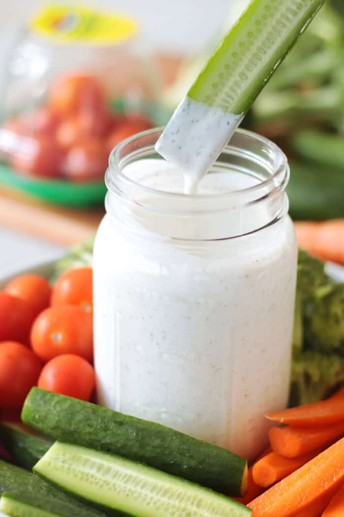 Cucumber spear dipped into homemade ranch dressing.