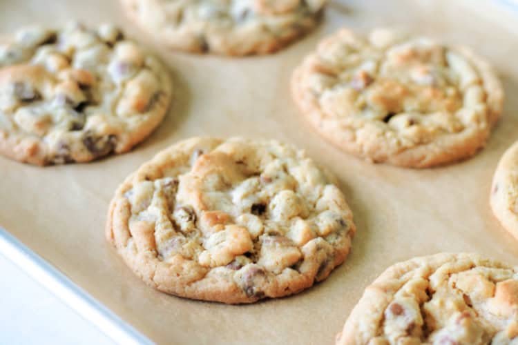 chocolate chip peanut butter cookies on baking sheet with parchment paper