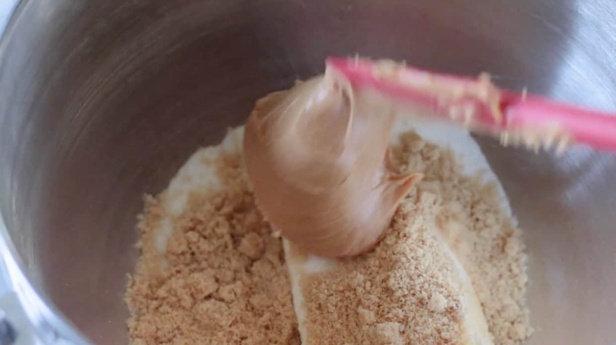 Mixing bowl with peanut butter, sugars and butter.