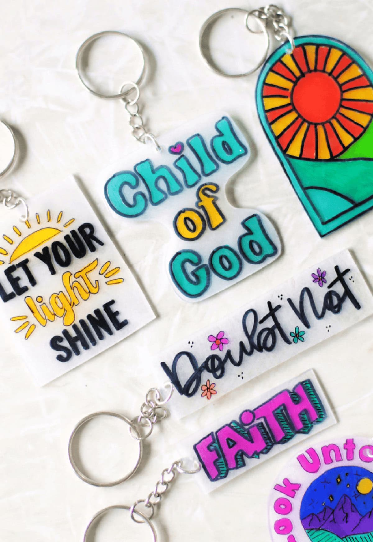 Variety of colored shrinky dink key chains.