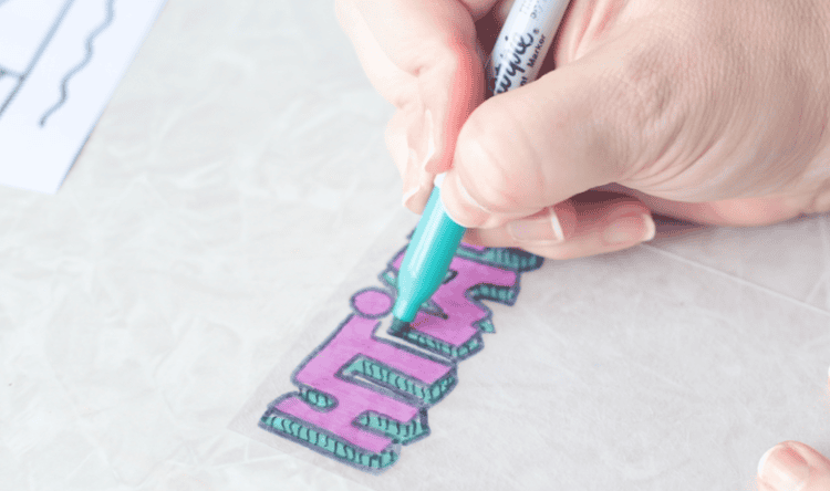 hand coloring back of shrinky dink sheet