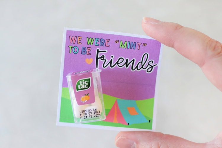 hand holding printable tag with tic tacs on it