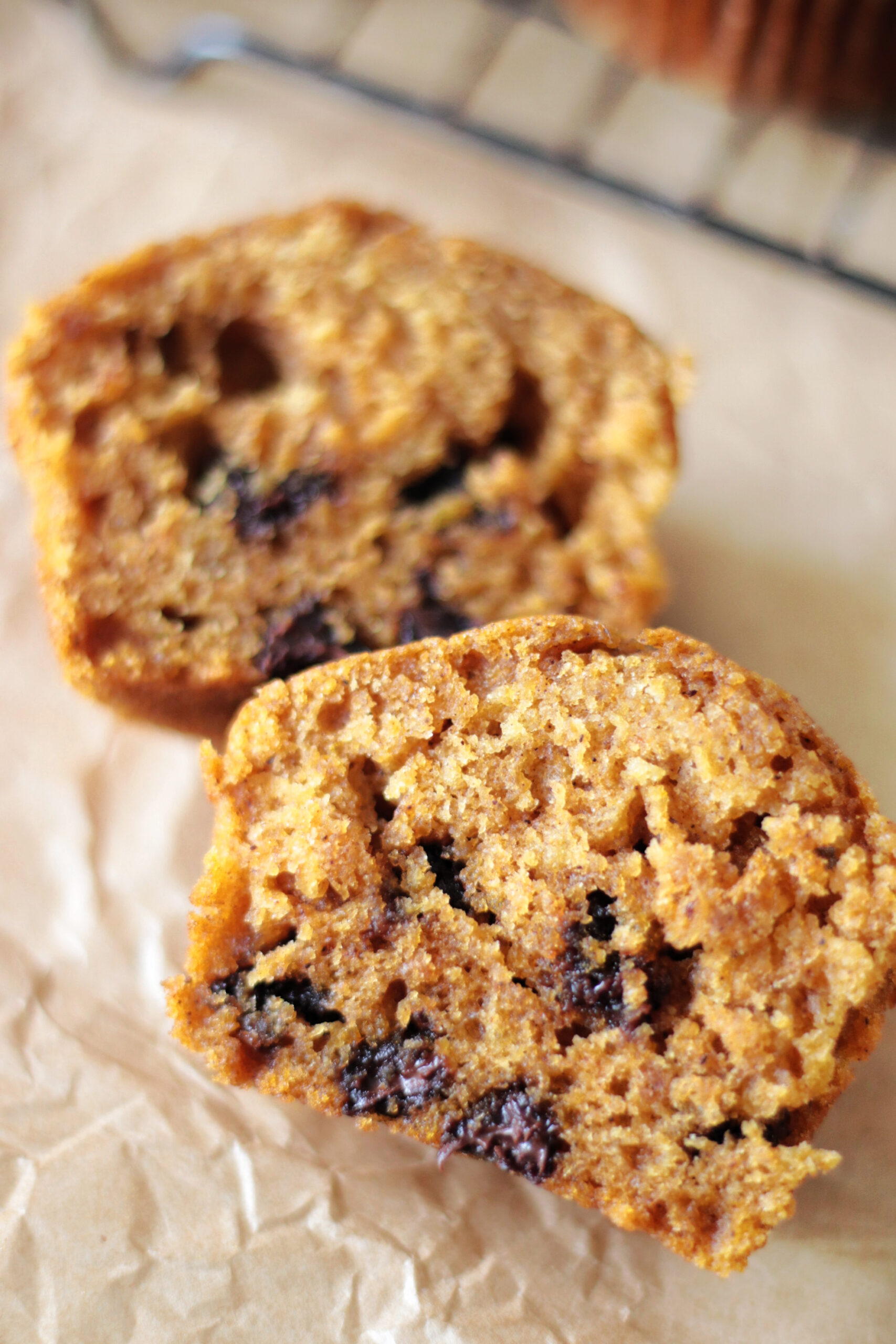 Pumpkin chocolate chip muffin cut in half.