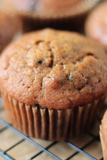 Pumpkin muffins on cooling rack.