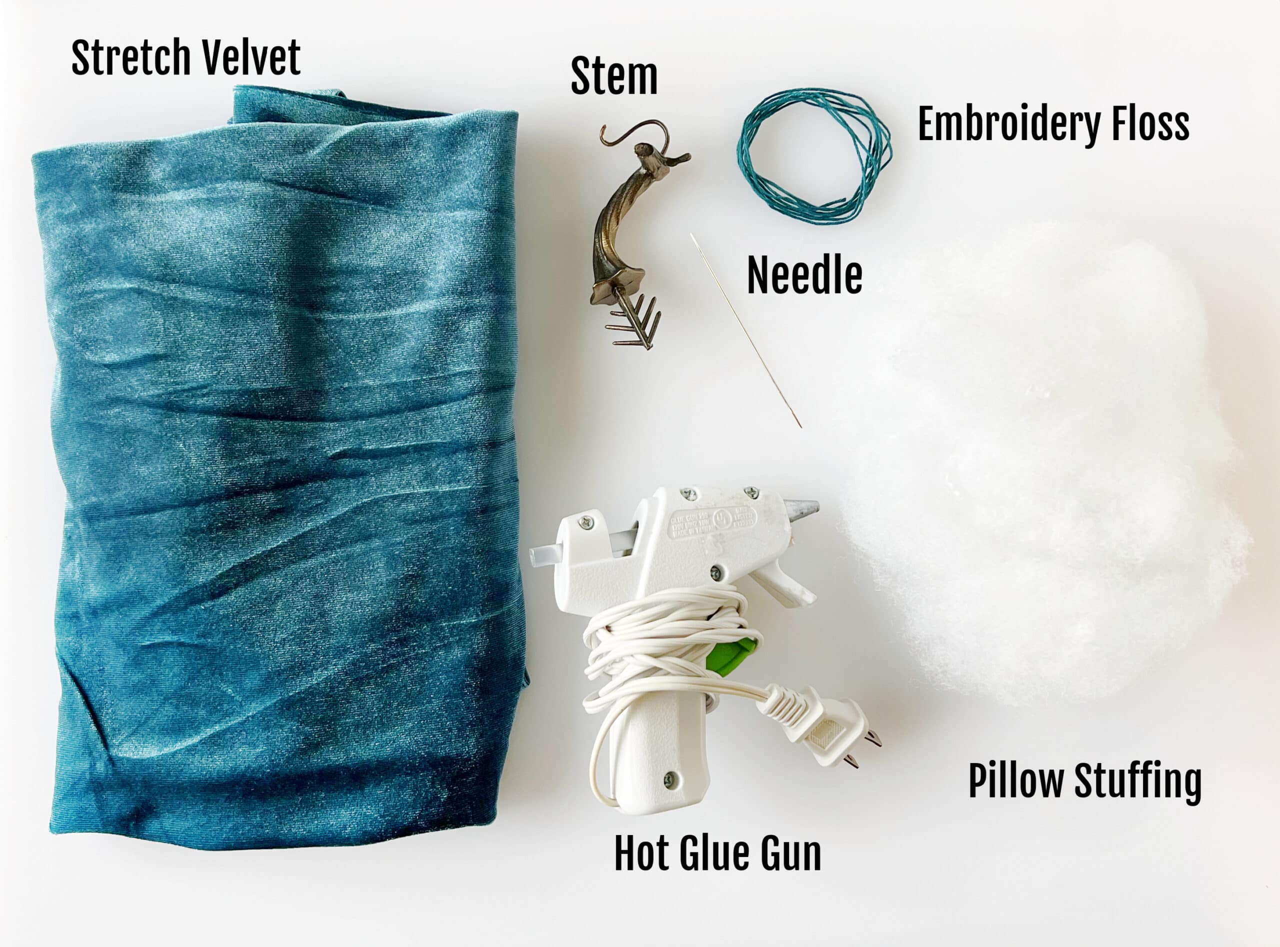 Blue velvet, plastic pumpkin stem, needle and thread, pillow stuffing and hot glue gun.