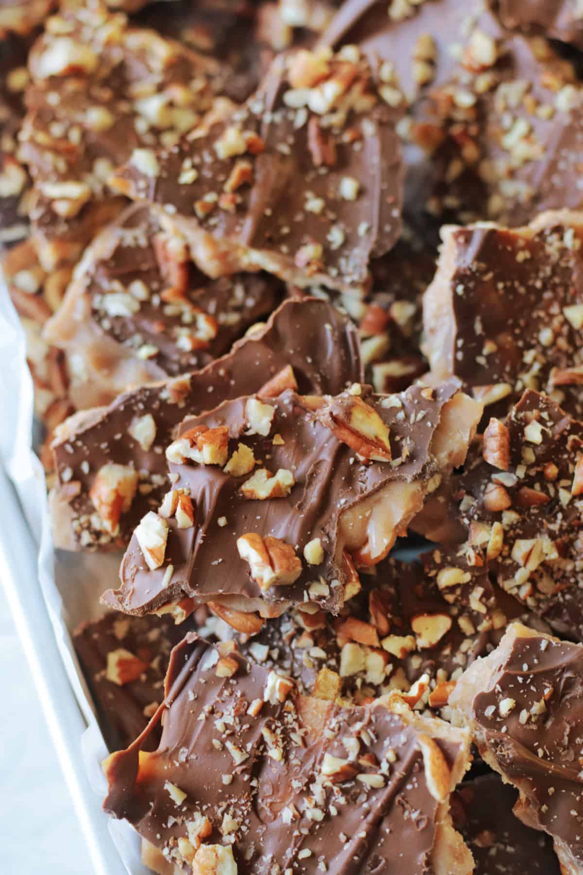 Baking sheet of Christmas crack broken into pieces.