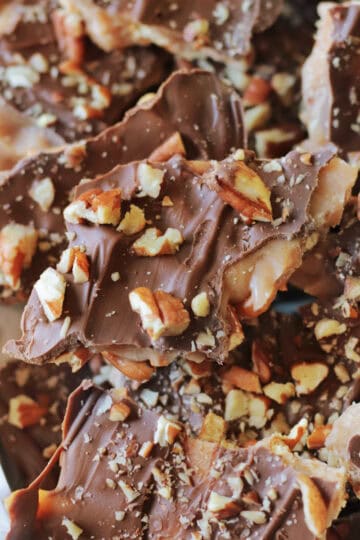 Broken pieces of Christmas crack on a baking sheet.