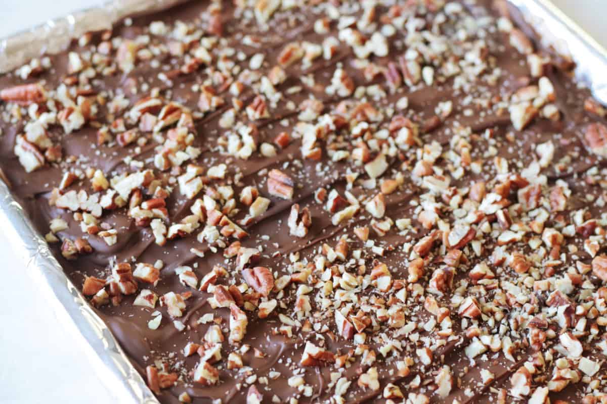 Baking sheet wrapped in foil with unbroken Christmas crack.