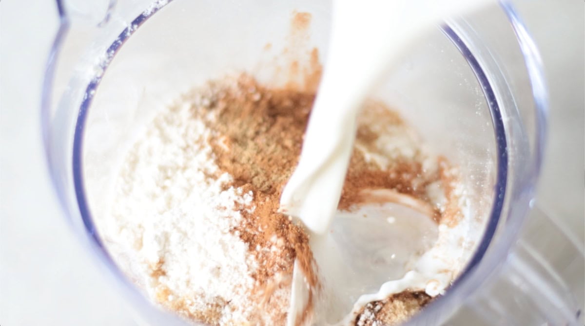 Half and half poured into blender with pumpkin pie filling ingredients.
