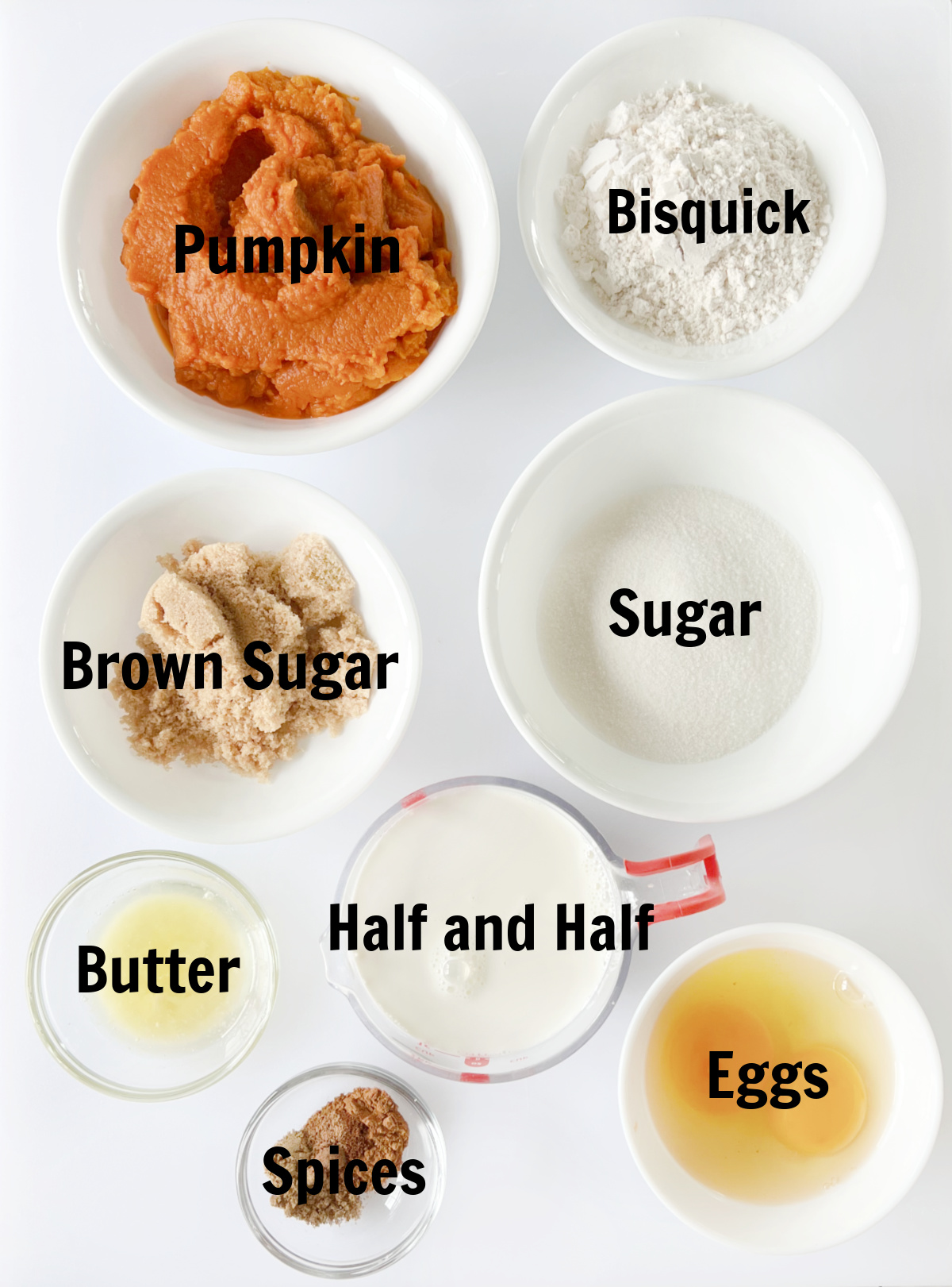 Bowls of pumpkin puree, Bisquick, brown sugar, sugar, half and half, melted butter, spices and eggs.