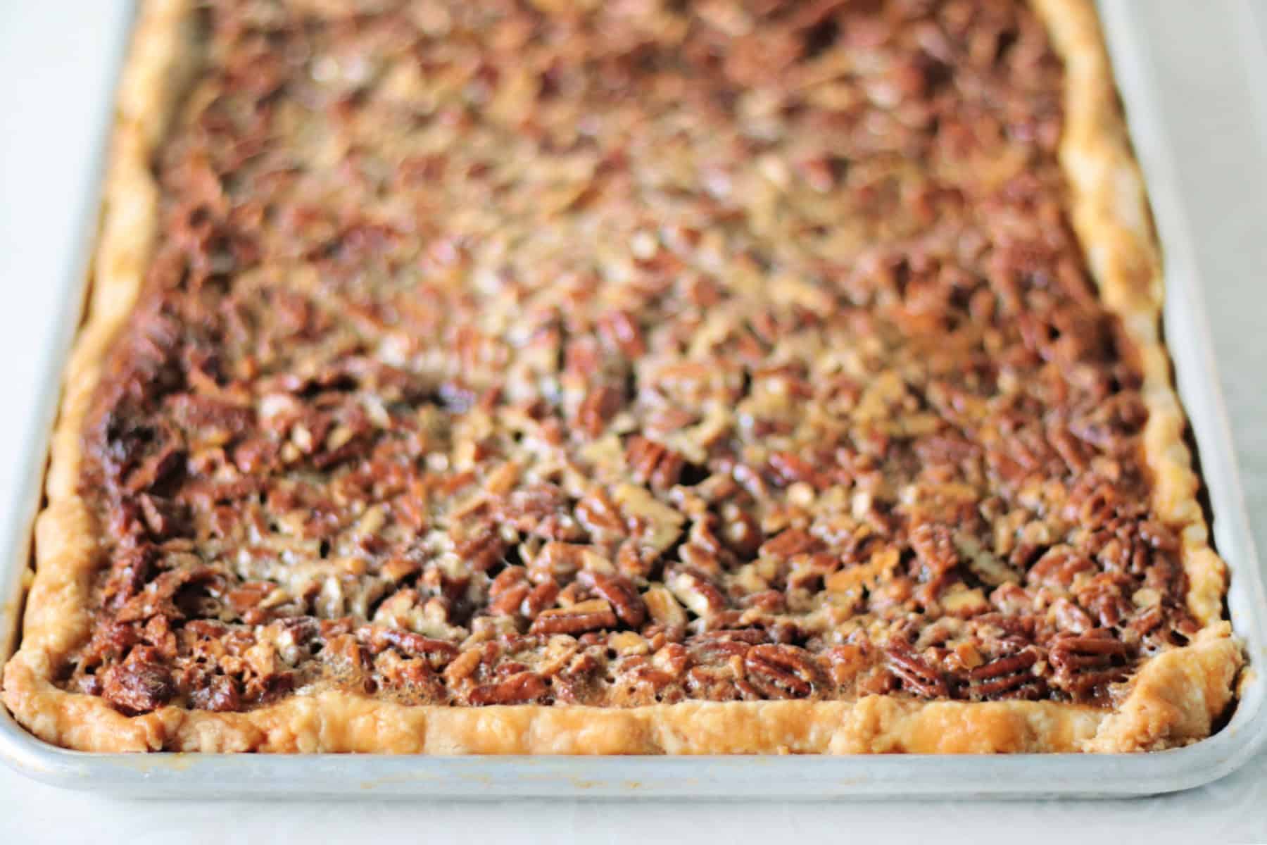 Pecan pie in a jelly roll pan.