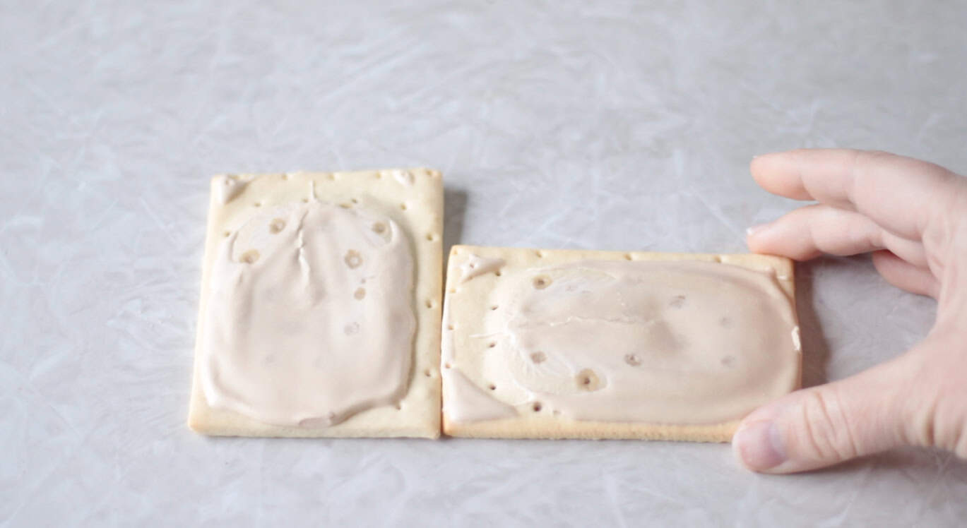 Two brown sugar pop tarts, one rotated to the side.