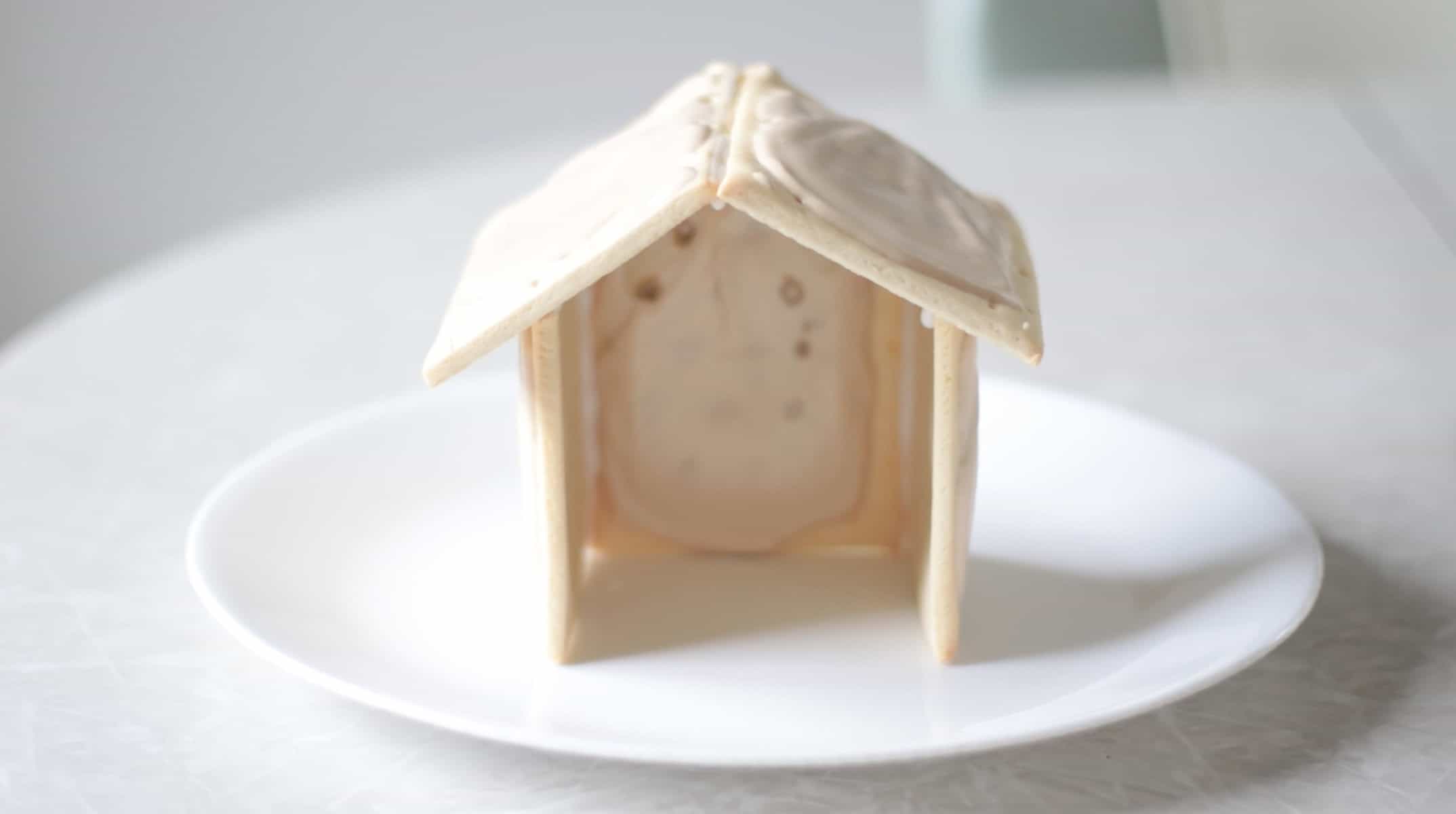 Pop tart stable for nativity on a white plate.