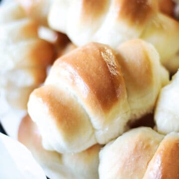 Crescent rolls in a wire basket.