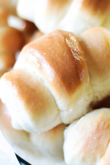 Wire basket of crescent rolls.
