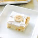 Slice of banana cream slab pie on a white plate.