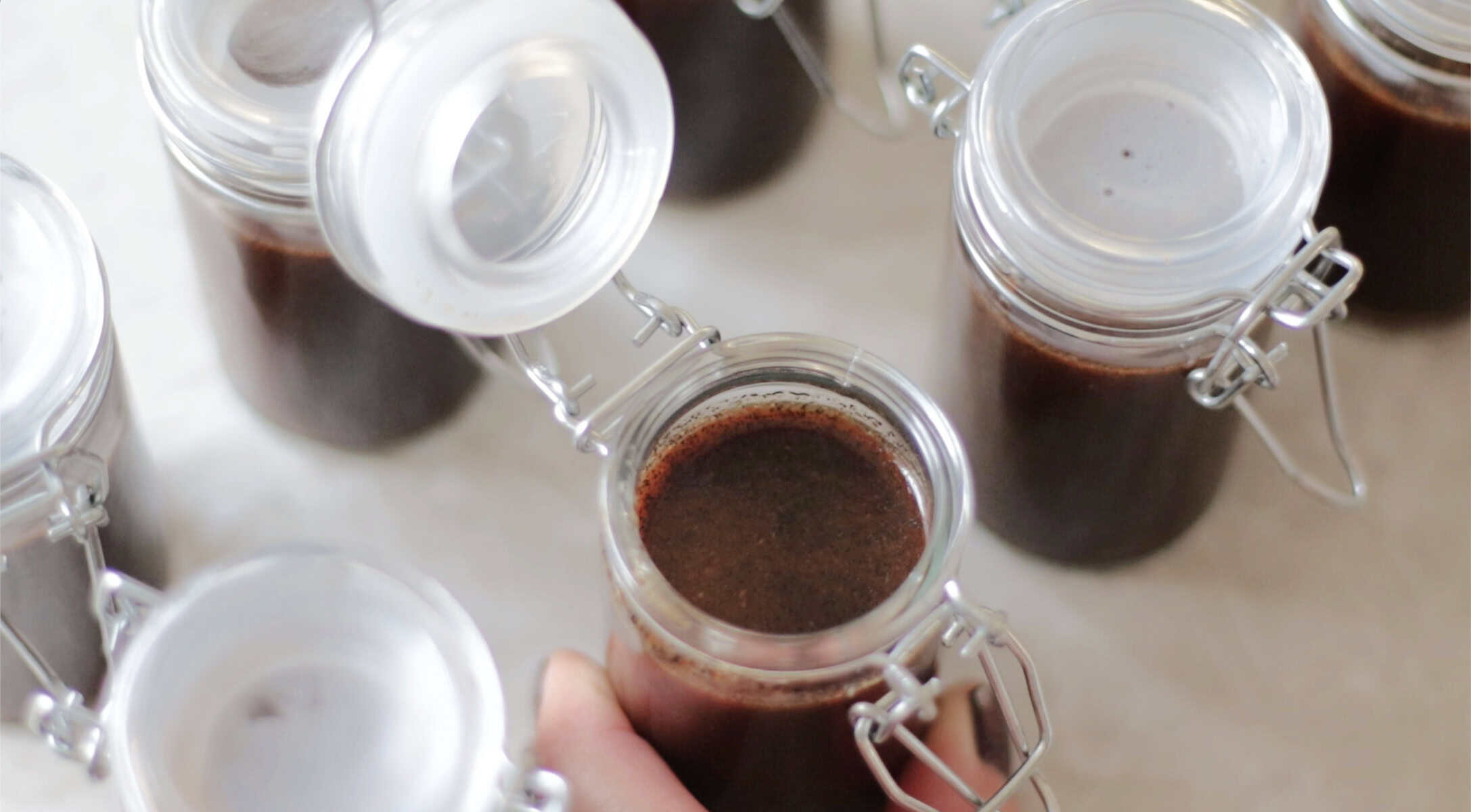 Open jars of vanilla paste.