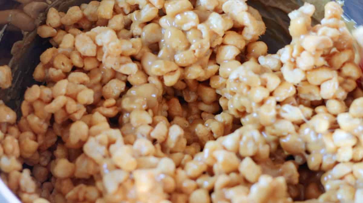 Bowl of caramel mixture and cereal.