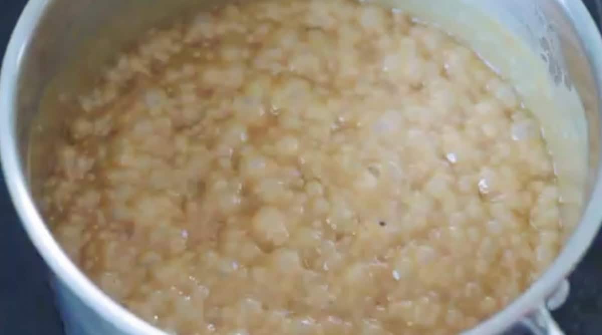 Saucepan of simmering caramel sauce.