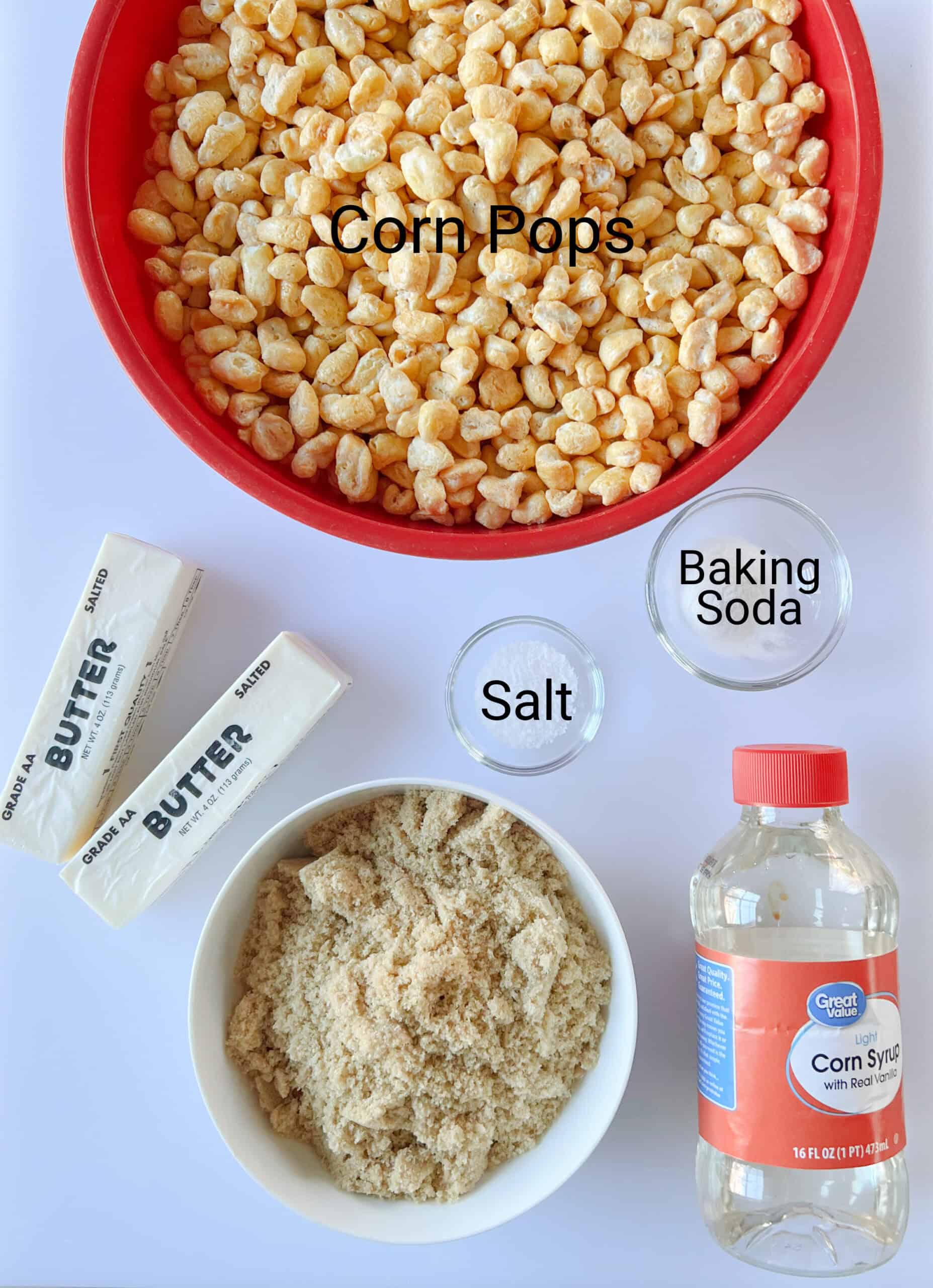 Bowls of corn pops cereal, brown sugar, salt and baking soda with two sticks of butter and bottle of corn syrup.