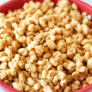 Batch of beaver nuggets in red plastic bowl.